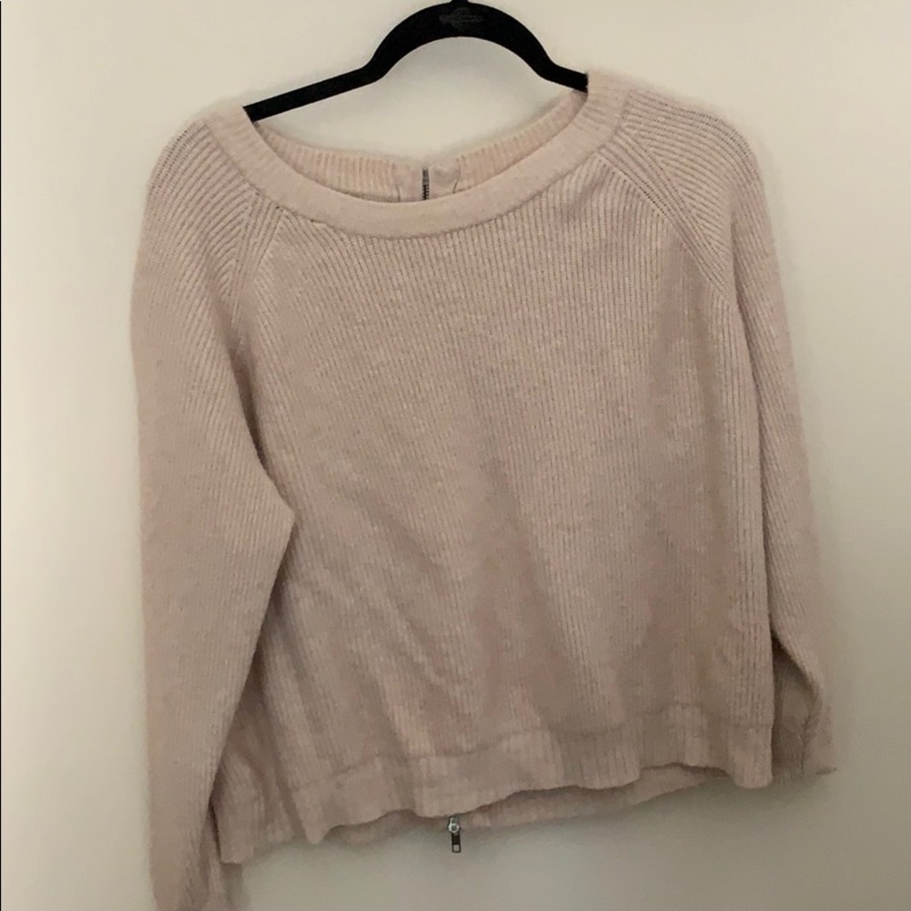 A really nice sweater. Used. Still really soft.